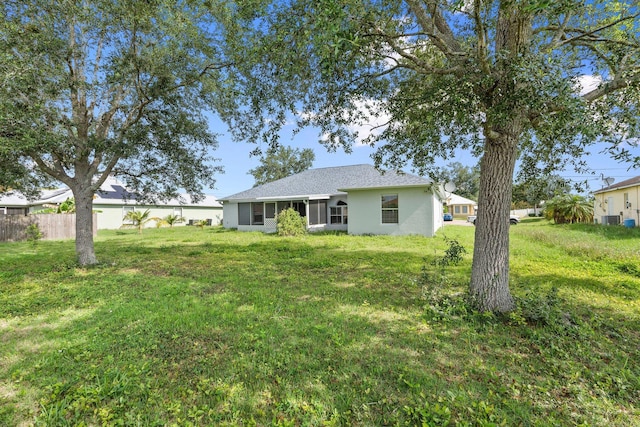 1552 SW Neponset Rd, Port Saint Lucie, FL 34953 - back of property with stucco siding and central air condition unit