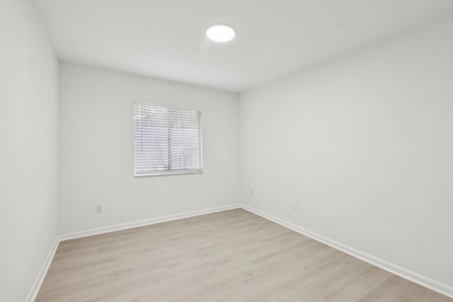 1803 NE 29th Pl, Ocala, FL 34479 - spare room featuring light wood finished floors and baseboards