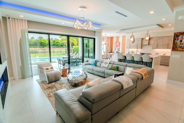 8305 Fishhawk Falls Ct, Boca Raton, FL 33496 - living room with a chandelier, recessed lighting, and baseboards