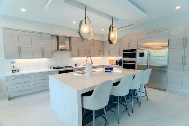 8305 Fishhawk Falls Ct, Boca Raton, FL 33496 - kitchen with stainless steel appliances, wall chimney range hood, modern cabinets, a sink, and a breakfast bar area