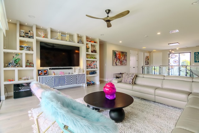 8305 Fishhawk Falls Ct, Boca Raton, FL 33496 - living area with wood finished floors, built in shelves, ceiling fan, and baseboards