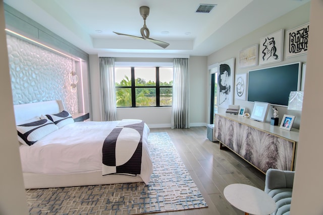 8305 Fishhawk Falls Ct, Boca Raton, FL 33496 - bedroom featuring a raised ceiling, wood finished floors, baseboards, and ceiling fan