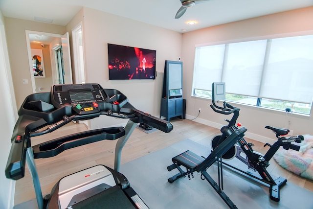 8305 Fishhawk Falls Ct, Boca Raton, FL 33496 - workout room featuring wood finished floors and baseboards
