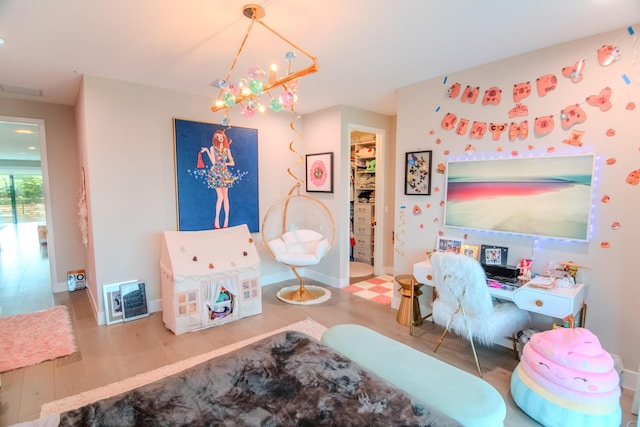 8305 Fishhawk Falls Ct, Boca Raton, FL 33496 - bedroom featuring wood finished floors, a chandelier, baseboards, and a spacious closet