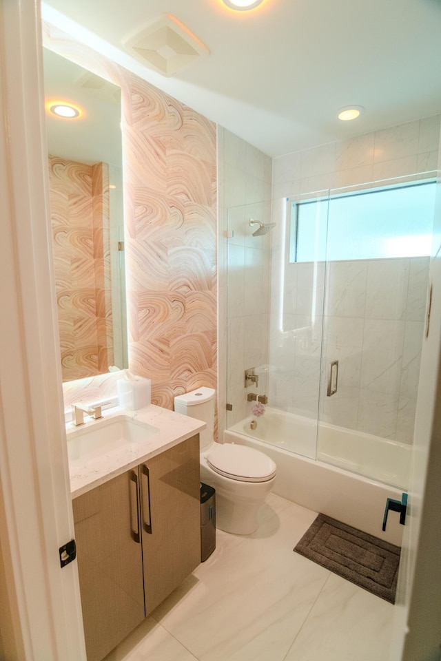 8305 Fishhawk Falls Ct, Boca Raton, FL 33496 - bathroom featuring toilet, combined bath / shower with glass door, vanity, wallpapered walls, and tile patterned floors
