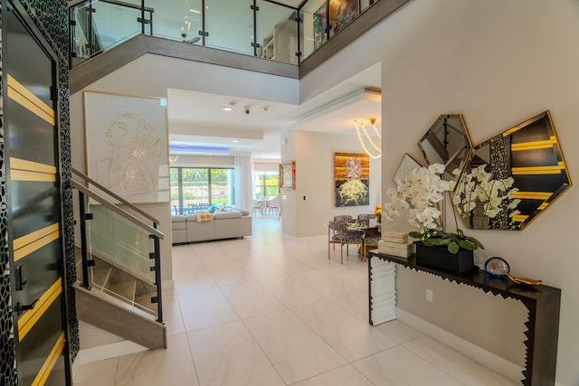 8305 Fishhawk Falls Ct, Boca Raton, FL 33496 - tiled entryway featuring stairway and a towering ceiling