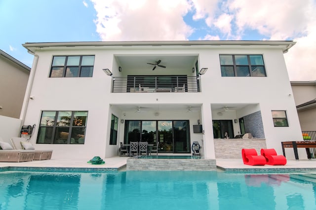 8305 Fishhawk Falls Ct, Boca Raton, FL 33496 - rear view of house featuring ceiling fan, a balcony, and stucco siding