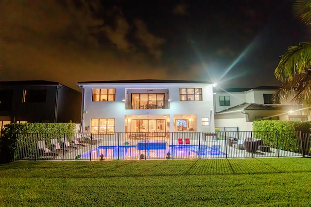 8305 Fishhawk Falls Ct, Boca Raton, FL 33496 - back of house at twilight with stucco siding and a patio area