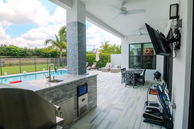 8305 Fishhawk Falls Ct, Boca Raton, FL 33496 - fenced backyard featuring a sink, ceiling fan, area for grilling, outdoor dining area, and a patio