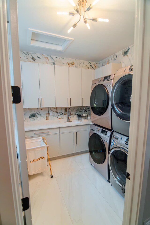 8305 Fishhawk Falls Ct, Boca Raton, FL 33496 - laundry area with stacked washer / drying machine and cabinet space