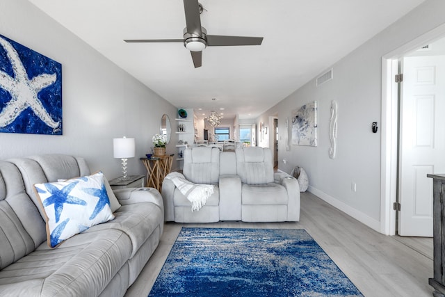7430 S Ocean Dr Unit 518, Jensen Beach, FL 34957 - living room featuring ceiling fan, light wood finished floors, and baseboards
