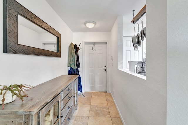 5285 SE Jennings Ln, Stuart, FL 34997 - doorway with light tile patterned floors and baseboards