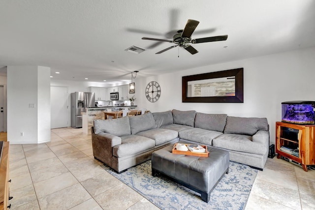 5285 SE Jennings Ln, Stuart, FL 34997 - living room with ceiling fan, recessed lighting, and light tile patterned floors