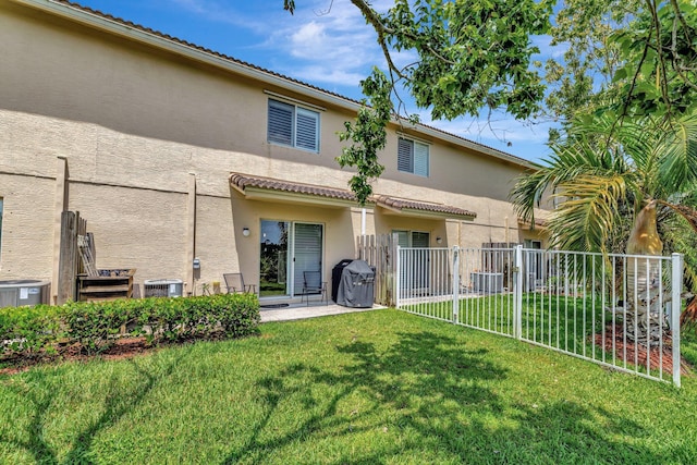 5285 SE Jennings Ln, Stuart, FL 34997 - rear view of property featuring stucco siding, central AC, and a patio area