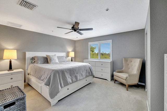 5285 SE Jennings Ln, Stuart, FL 34997 - bedroom with light carpet and a ceiling fan