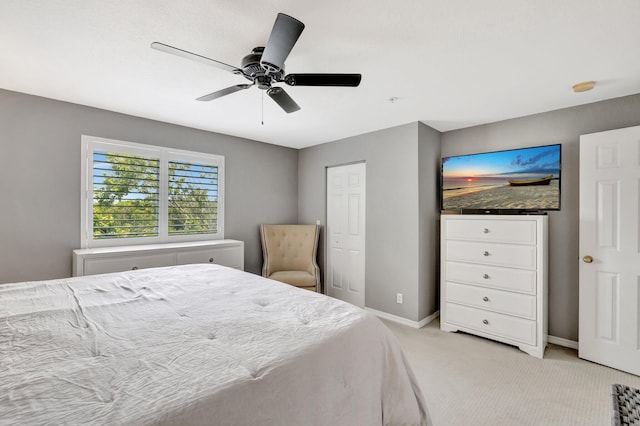 5285 SE Jennings Ln, Stuart, FL 34997 - bedroom with light colored carpet, baseboards, and ceiling fan