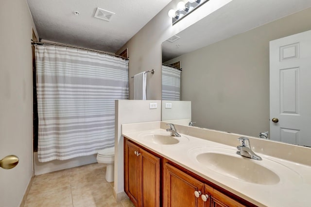 5285 SE Jennings Ln, Stuart, FL 34997 - full bath featuring double vanity, toilet, baseboards, tile patterned flooring, and shower / bathtub combination with curtain