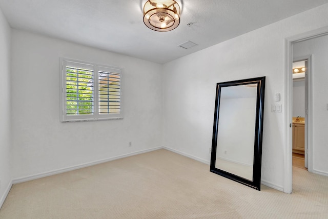 5285 SE Jennings Ln, Stuart, FL 34997 - unfurnished bedroom featuring light colored carpet and baseboards
