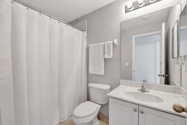 5285 SE Jennings Ln, Stuart, FL 34997 - bathroom with toilet, vanity, wood finished floors, and a shower with shower curtain