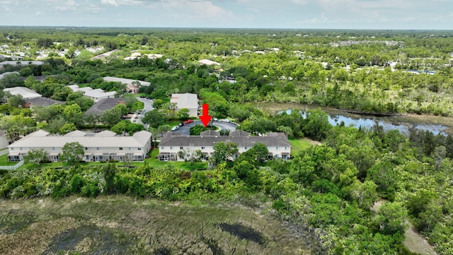 5285 SE Jennings Ln, Stuart, FL 34997 - aerial overview of property's location featuring a heavily wooded area and a nearby body of water