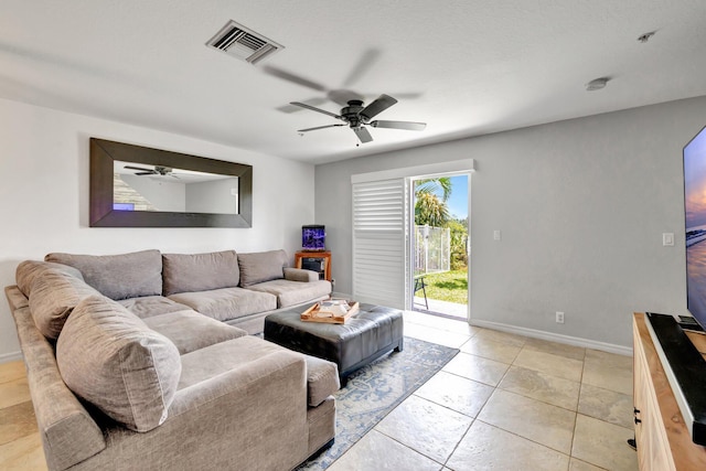 5285 SE Jennings Ln, Stuart, FL 34997 - living room with ceiling fan, baseboards, and light tile patterned floors