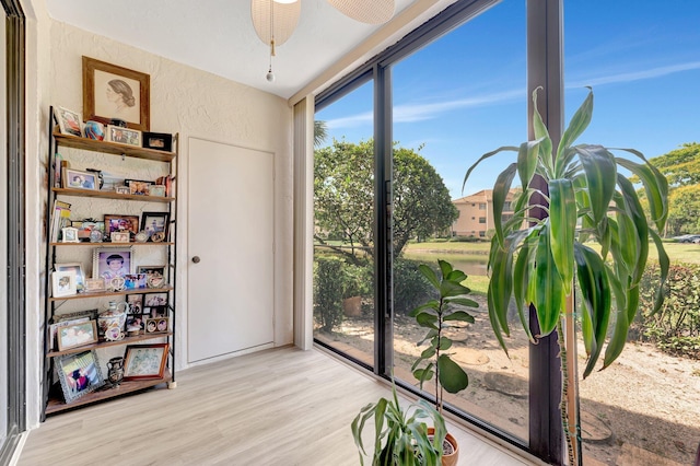 4101 Coral Tree Cir Unit 116, Coconut Creek, FL 33073 - interior space featuring a textured wall, wood finished floors, and a ceiling fan