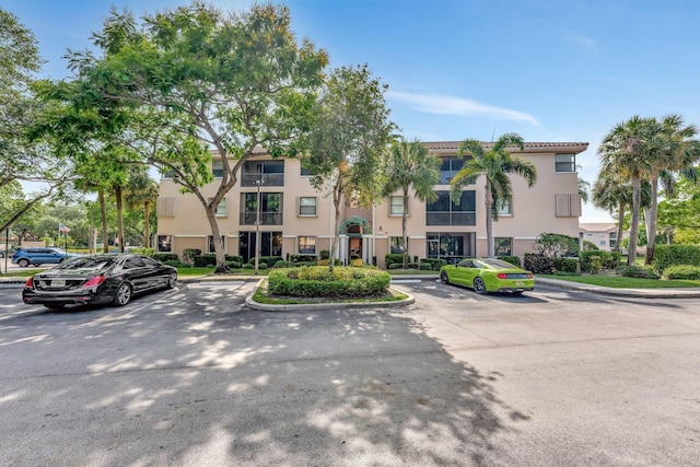 4101 Coral Tree Cir Unit 116, Coconut Creek, FL 33073 - view of property featuring uncovered parking