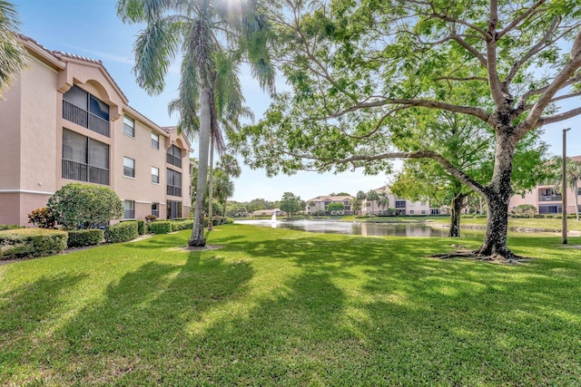 4101 Coral Tree Cir Unit 116, Coconut Creek, FL 33073 - view of community featuring a water view and a yard