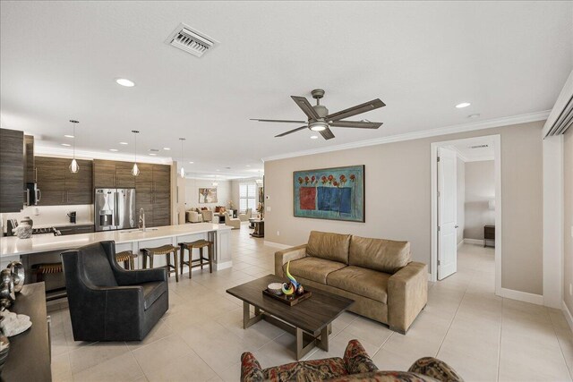 11688 SW Brighton Falls Dr, Port Saint Lucie, FL 34987 - living area with recessed lighting, a ceiling fan, ornamental molding, light tile patterned flooring, and baseboards