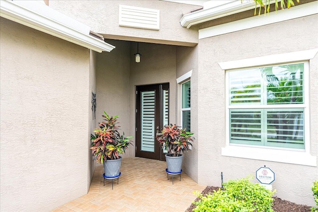 11688 SW Brighton Falls Dr, Port Saint Lucie, FL 34987 - entrance to property featuring stucco siding and a patio area