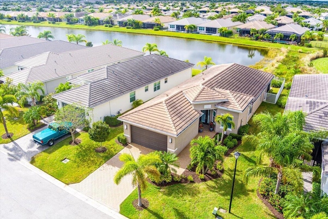 11688 SW Brighton Falls Dr, Port Saint Lucie, FL 34987 - aerial perspective of suburban area with a nearby body of water