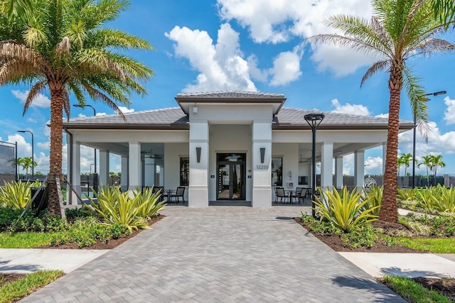 11688 SW Brighton Falls Dr, Port Saint Lucie, FL 34987 - view of front of property featuring stucco siding, ceiling fan, and a tiled roof