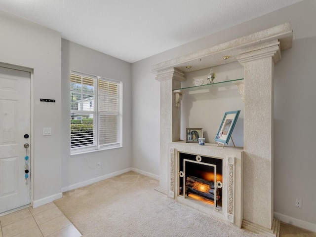 2536 Creekside Dr, Fort Pierce, FL 34981 - carpeted living room with a lit fireplace and baseboards