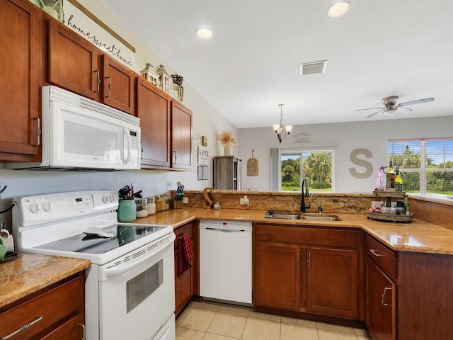 2536 Creekside Dr, Fort Pierce, FL 34981 - kitchen featuring white appliances, a sink, plenty of natural light, a peninsula, and recessed lighting