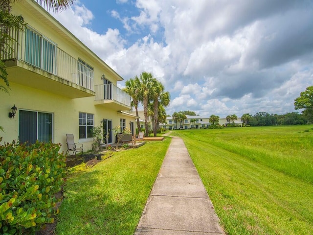 2536 Creekside Dr, Fort Pierce, FL 34981 - view of green lawn with a balcony
