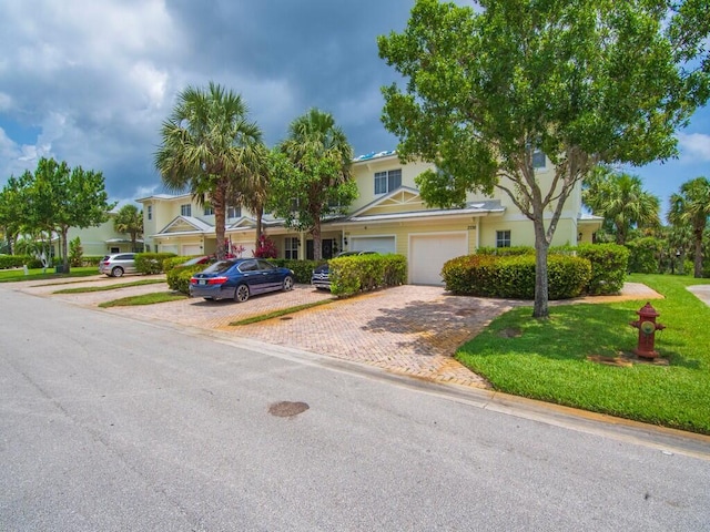 2536 Creekside Dr, Fort Pierce, FL 34981 - view of front of property with decorative driveway and a front lawn