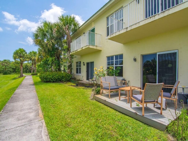 2536 Creekside Dr, Fort Pierce, FL 34981 - view of grassy yard with a balcony and a wooden deck