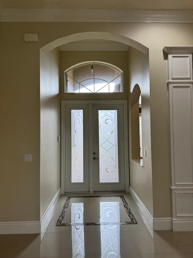 10469 Whitewind Cir, Boynton Beach, FL 33473 - foyer entrance featuring arched walkways, baseboards, and crown molding