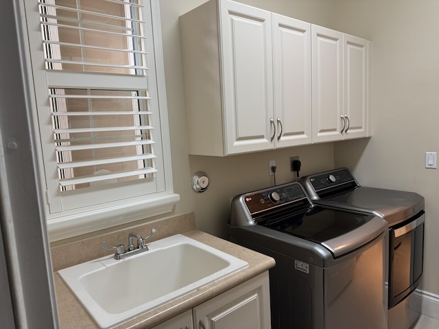 10469 Whitewind Cir, Boynton Beach, FL 33473 - washroom featuring washing machine and clothes dryer, cabinet space, and radiator heating unit