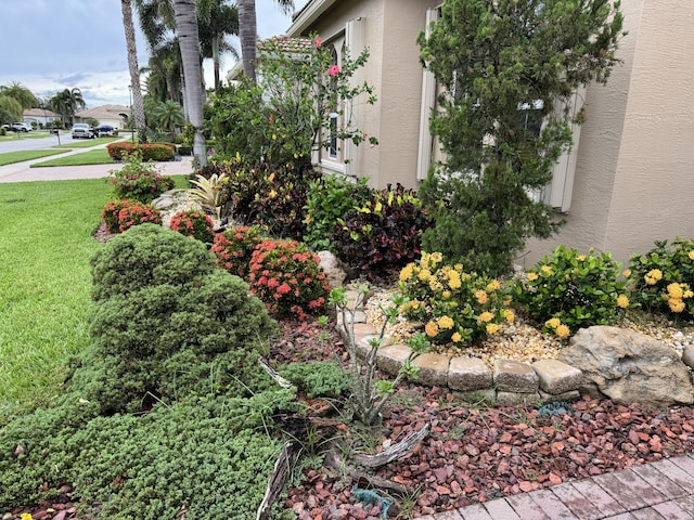 10469 Whitewind Cir, Boynton Beach, FL 33473 - view of home's exterior featuring stucco siding and a yard