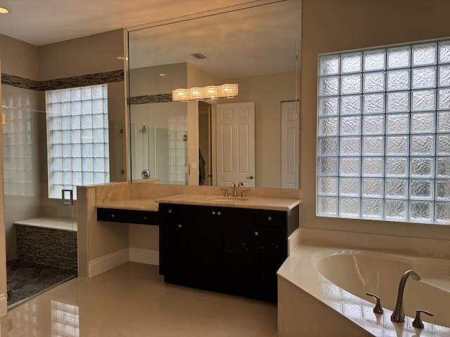10469 Whitewind Cir, Boynton Beach, FL 33473 - bathroom featuring a stall shower, a garden tub, vanity, and tile patterned floors