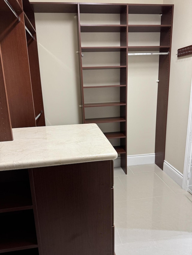 10469 Whitewind Cir, Boynton Beach, FL 33473 - walk in closet with tile patterned floors