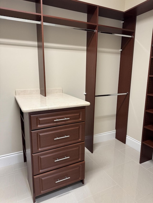 10469 Whitewind Cir, Boynton Beach, FL 33473 - spacious closet featuring light tile patterned flooring