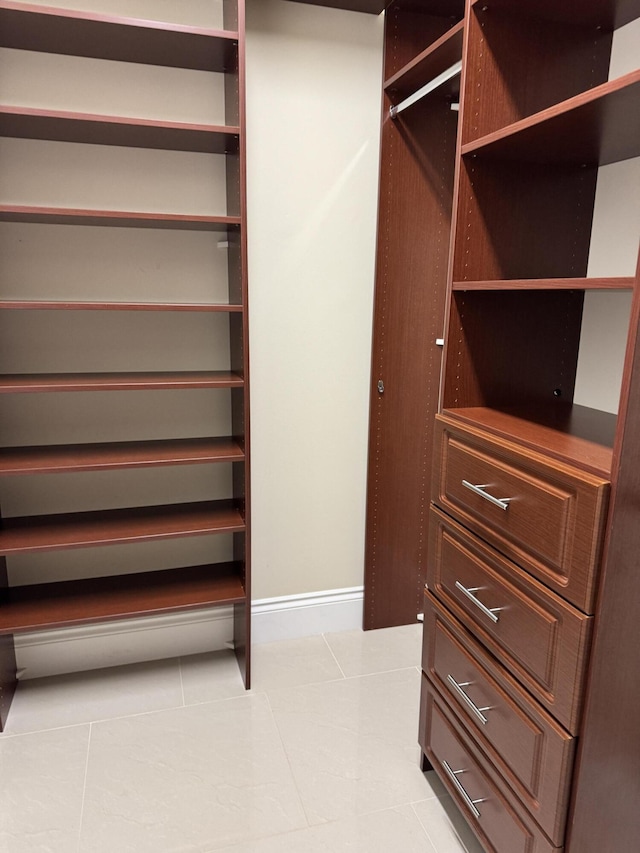 10469 Whitewind Cir, Boynton Beach, FL 33473 - walk in closet featuring light tile patterned floors