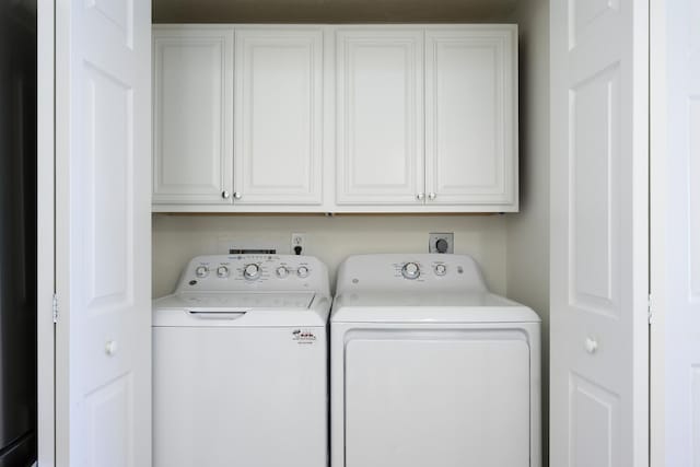 508 Sea Oats Dr Unit A-1, Juno Beach, FL 33408 - washroom featuring separate washer and dryer and cabinet space