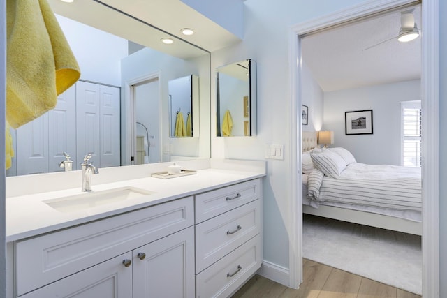 508 Sea Oats Dr Unit A-1, Juno Beach, FL 33408 - ensuite bathroom featuring vanity, wood finished floors, and baseboards
