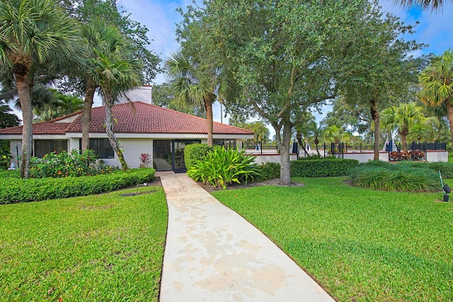 508 Sea Oats Dr Unit A-1, Juno Beach, FL 33408 - view of front of house featuring a tiled roof and stucco siding