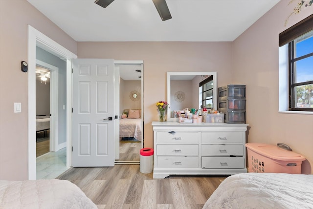 4501 N Australian Ave, West Palm Beach, FL 33407 - bedroom with light wood-type flooring and a ceiling fan