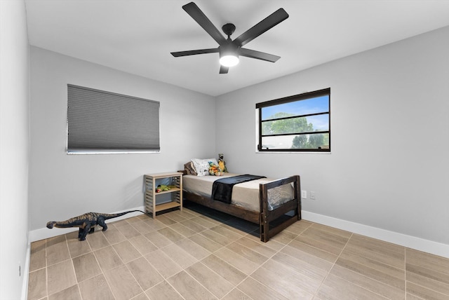 4501 N Australian Ave, West Palm Beach, FL 33407 - bedroom with ceiling fan and baseboards