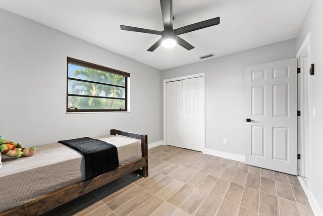 4501 N Australian Ave, West Palm Beach, FL 33407 - bedroom with a closet, baseboards, and ceiling fan